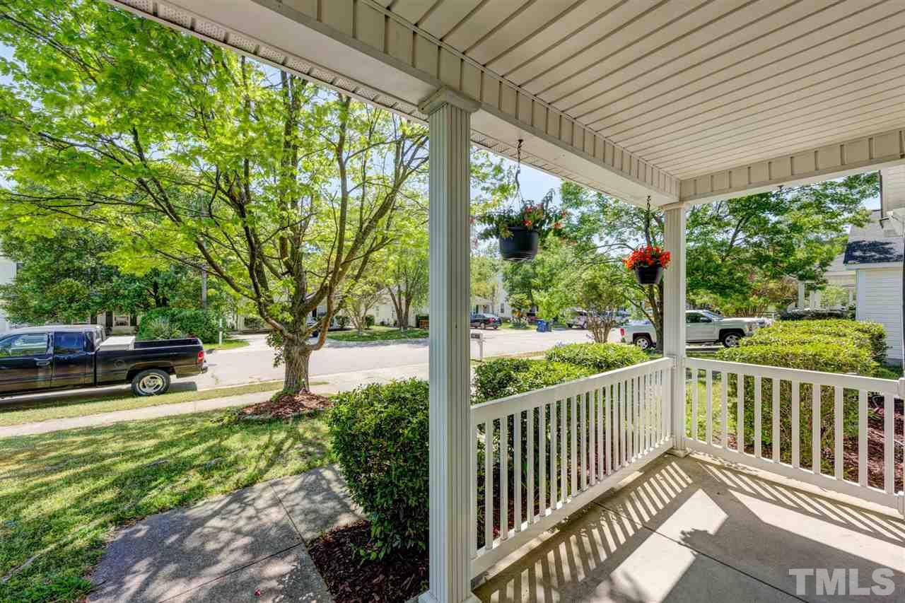 4845 Silverdene Street Raleigh, NC 27616 - Photo 3 of 24 a view of a patio with chairs and floor to ceiling window