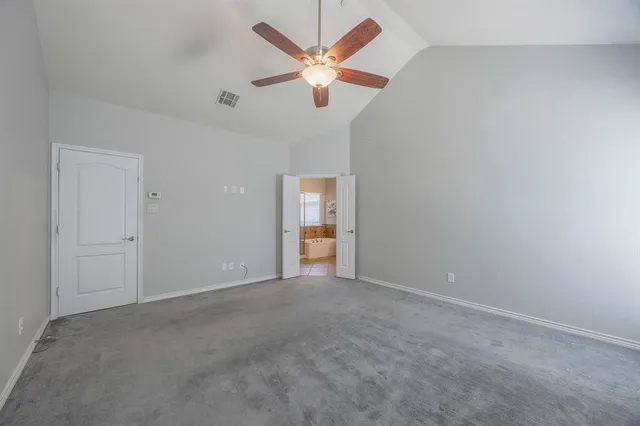 a bathroom with a tub a sink shower and mirror