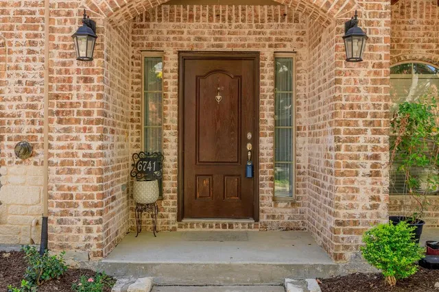 a front view of a house with swimming pool
