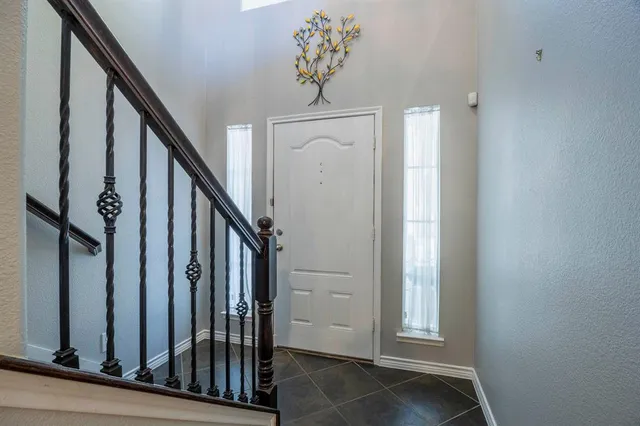 a view of an entryway with wooden floor