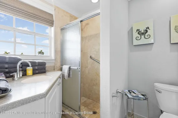 a bedroom with 2 bed and wooden floor