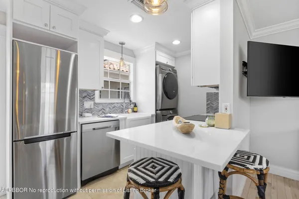 a balcony with furniture and a large window