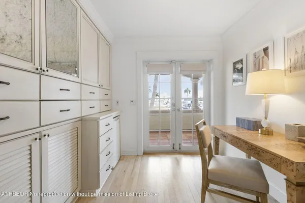 a bathroom with a granite countertop sink toilet a mirror and shower