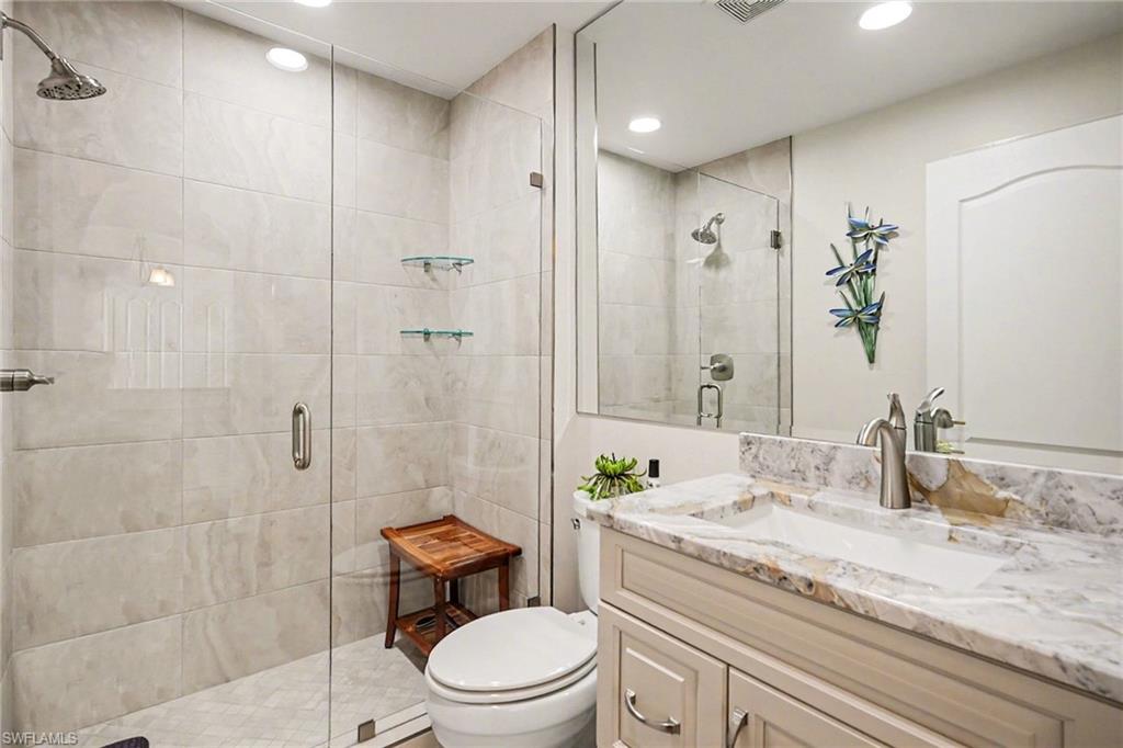9341 Spring Run Boulevard, Unit 3108 Estero, FL 34135 - Photo 24 of 30 Bathroom featuring a stall shower, vanity, and recessed lighting