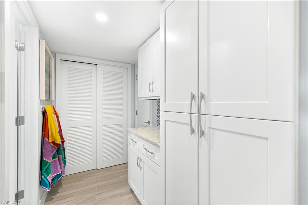 175 5th Avenue South, Unit 3 Naples, FL 34102 - Photo 14 of 31 a view of walk in closet with clothes and shoes