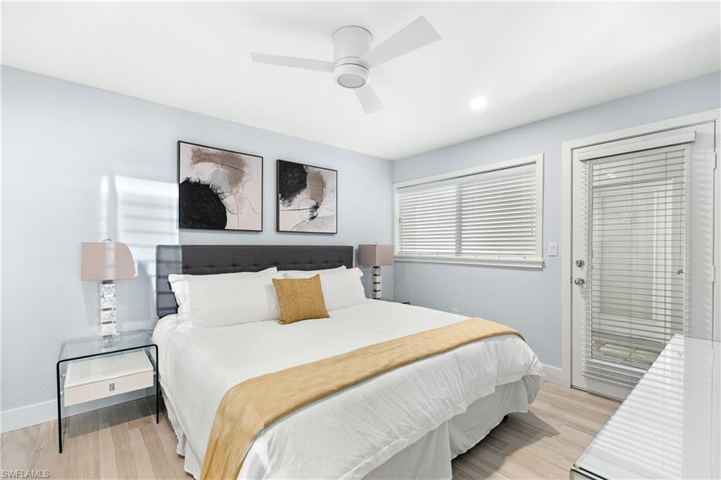 175 5th Avenue South, Unit 3 Naples, FL 34102 - Photo 18 of 31 a bedroom with a large bed and a window