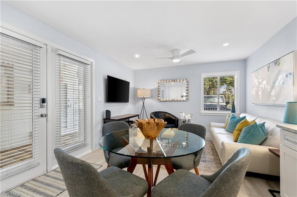 175 5th Avenue South, Unit 3 Naples, FL 34102 - Photo 25 of 31 a living room with furniture and a flat screen tv