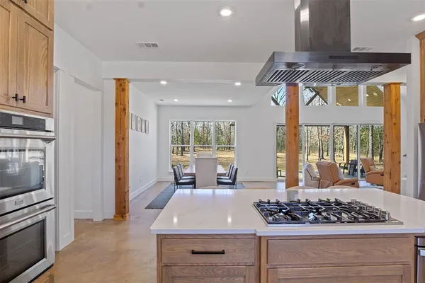 a kitchen with stainless steel appliances granite countertop a stove and a refrigerator
