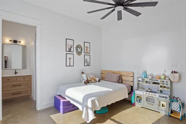 a bedroom with a bed and dresser