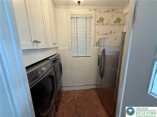 a bathroom with a sink a toilet and a shower