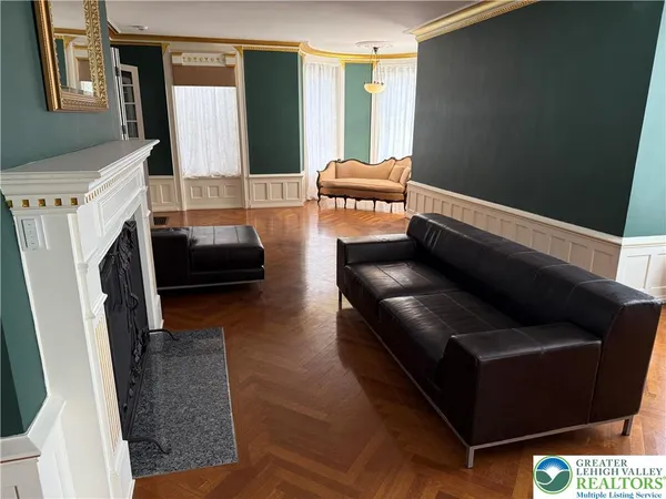 a kitchen with wooden floors and a stove