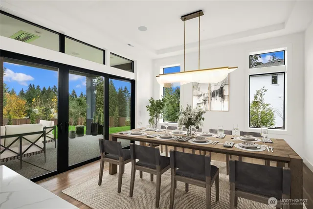 a view of a patio with table and chairs and potted plants
