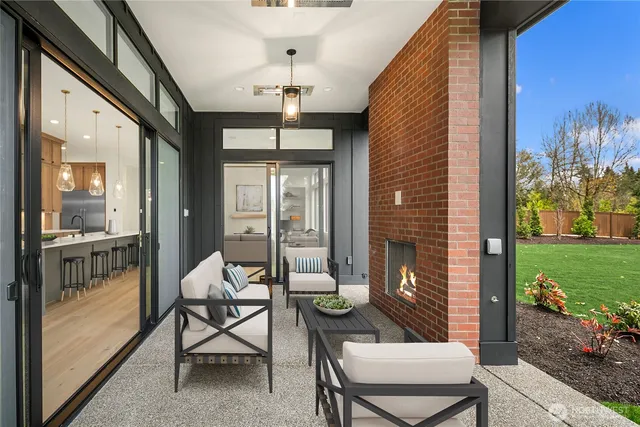 a view of a dining room with furniture large windows and wooden floor