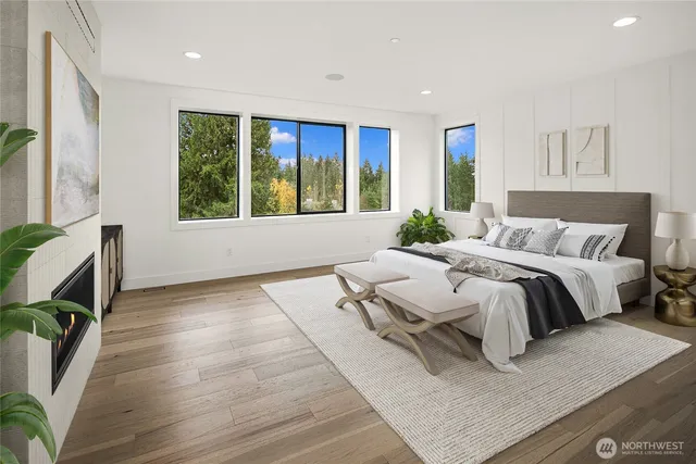 a spacious bedroom with a bed and a fireplace