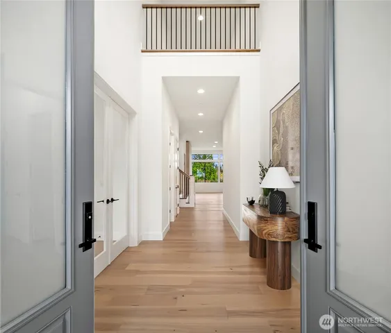 a kitchen with stainless steel appliances granite countertop a sink a stove and a refrigerator