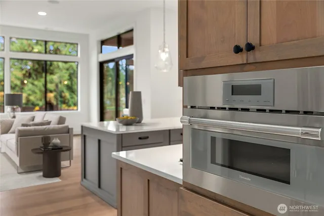a kitchen with stainless steel appliances granite countertop a stove and a sink