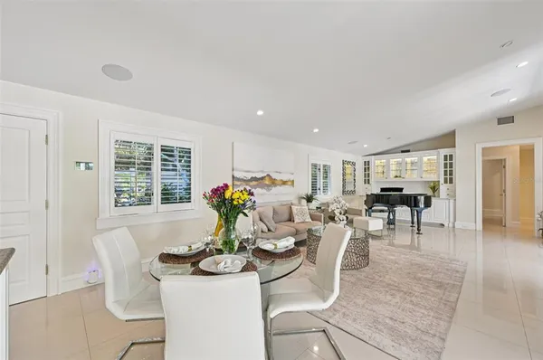 a kitchen with kitchen island granite countertop stainless steel appliances a sink stove and refrigerator