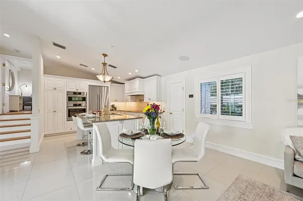 a kitchen with a stove a refrigerator and a sink