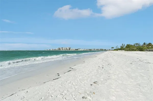 a view of an entryway with wooden floor and door
