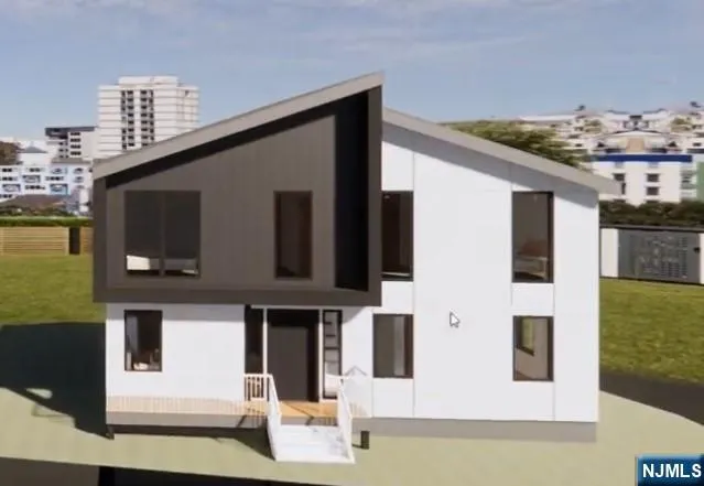 a front view of a house with a ocean view