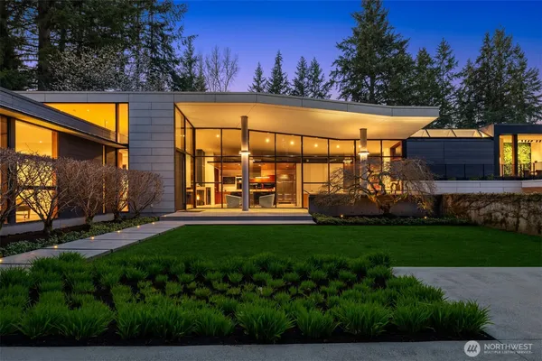 a view of a swimming pool with an outdoor seating and a yard
