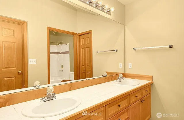 a bathroom with a sink and a mirror