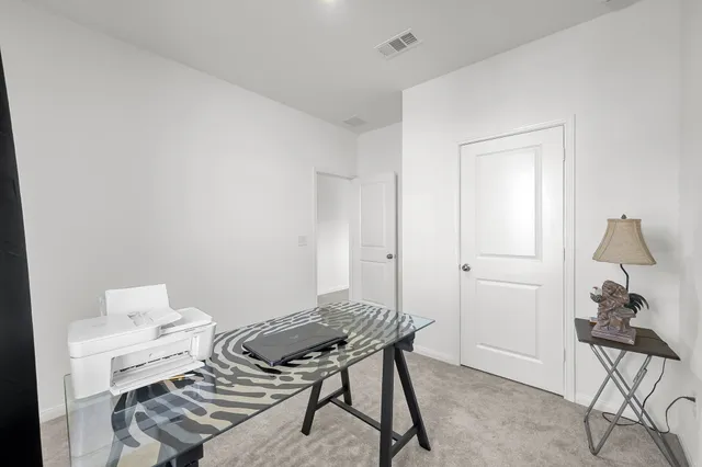 a view of storage and utility room with washer and dryer