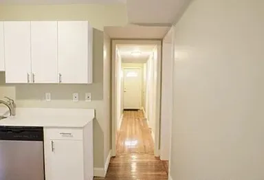a view of a kitchen with a sink