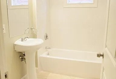4043 Washington Street, Unit 2 Boston, MA 02131 - Photo 8 of 8 a bathroom with a sink a shower