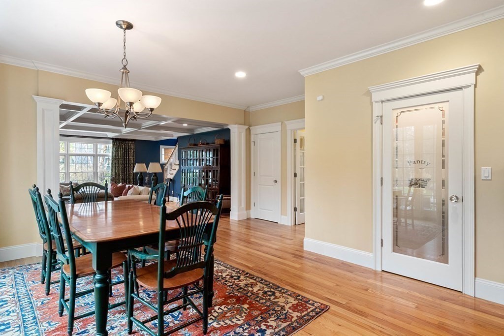 81 Pine Street Dover, MA 02030 - Photo 12 of 40 a dining room with furniture a chandelier and wooden floor