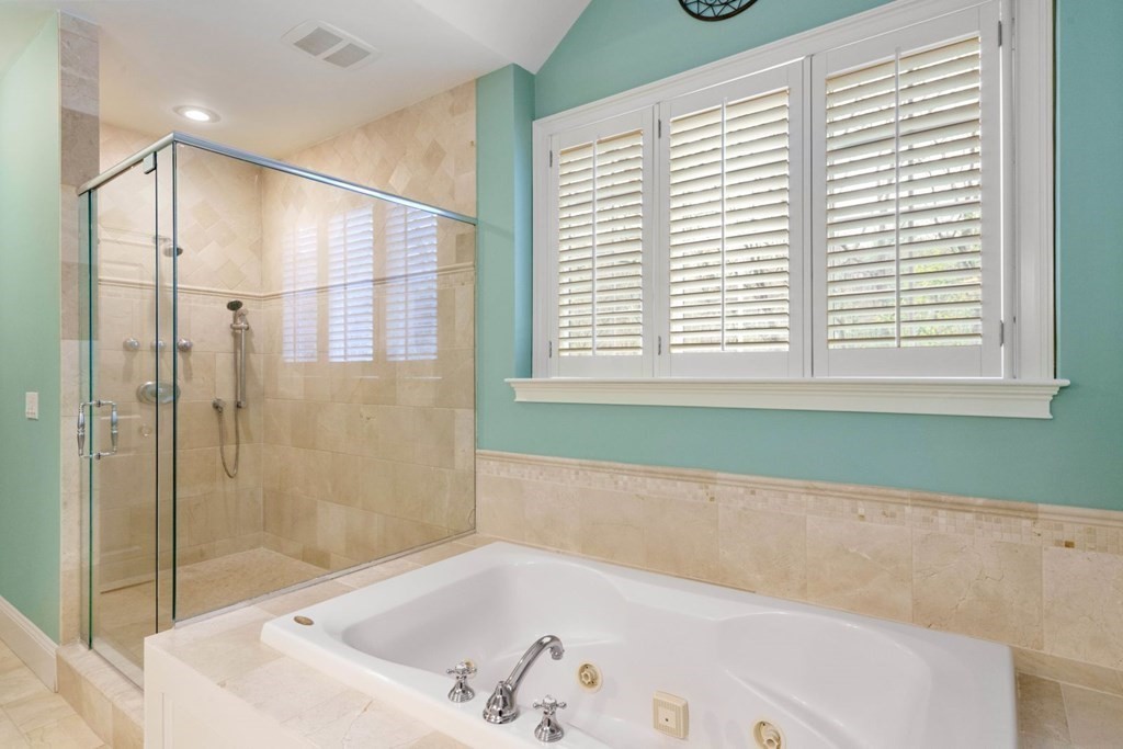 81 Pine Street Dover, MA 02030 - Photo 23 of 40 a bathroom with a bathtub and a shower