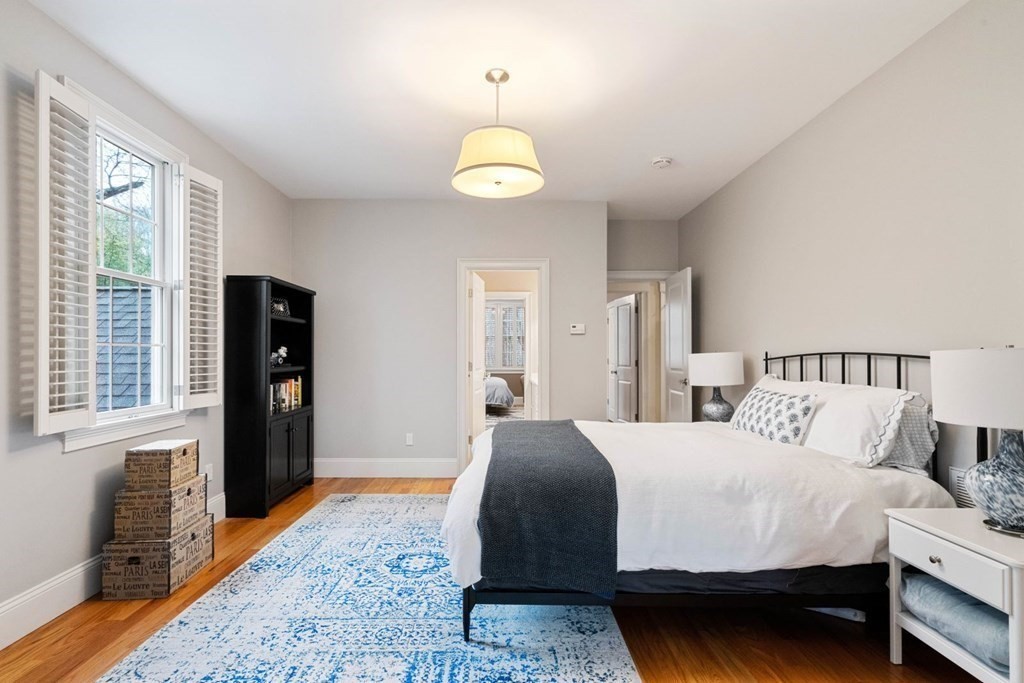 81 Pine Street Dover, MA 02030 - Photo 29 of 40 a bedroom with a bed and a window