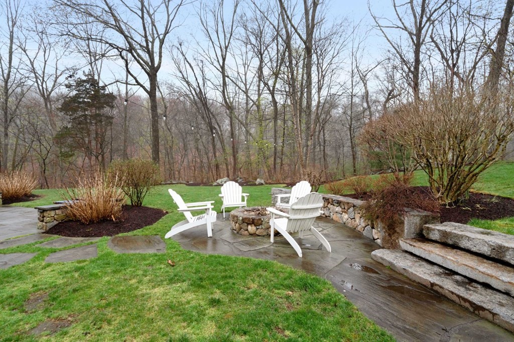 81 Pine Street Dover, MA 02030 - Photo 37 of 40 a backyard of a house with table and chairs