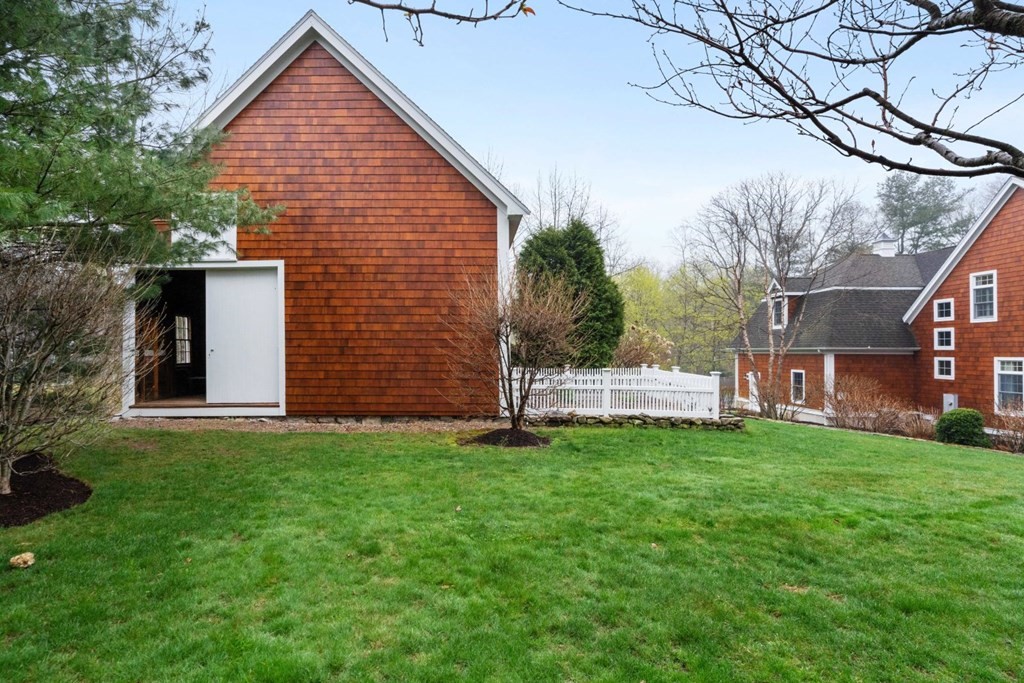 81 Pine Street Dover, MA 02030 - Photo 39 of 40 a view of a house with a yard