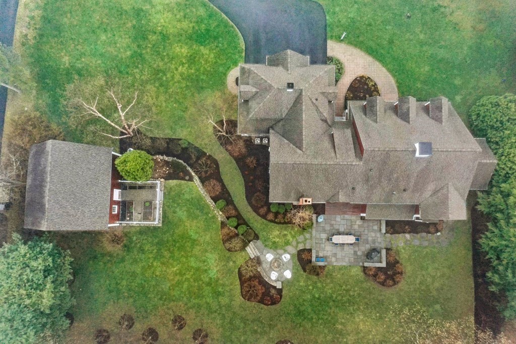 81 Pine Street Dover, MA 02030 - Photo 4 of 40 an aerial view of a house with a yard and lake view