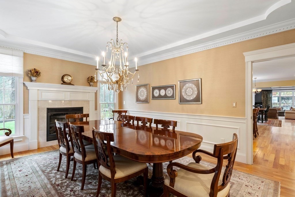 81 Pine Street Dover, MA 02030 - Photo 9 of 40 a view of a dining room with furniture and chandelier