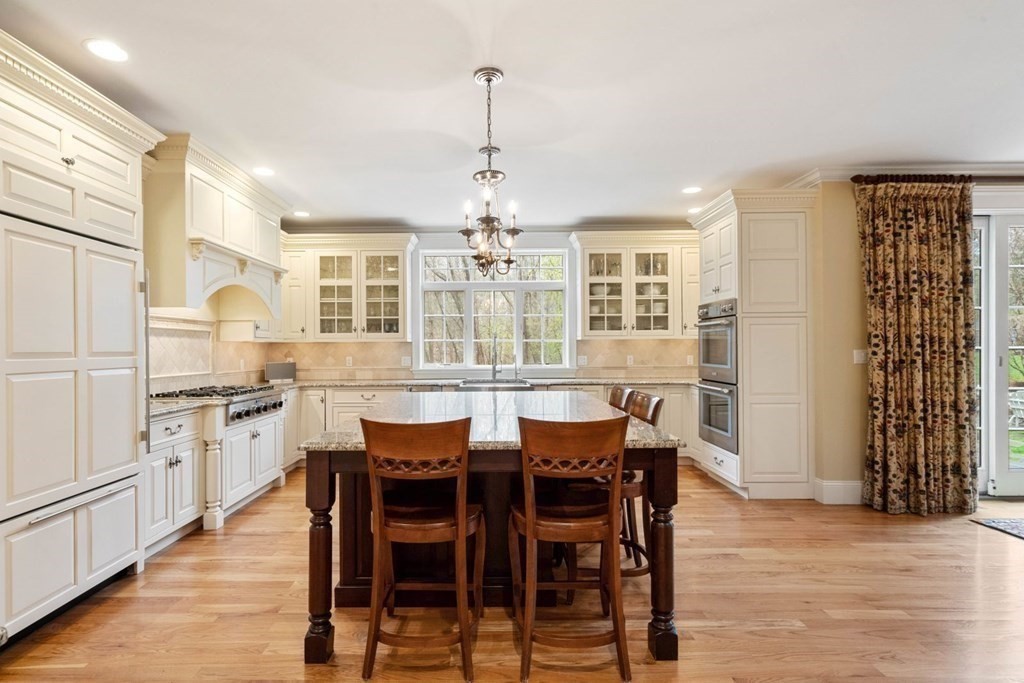 81 Pine Street Dover, MA 02030 - Photo 10 of 40 a kitchen with stainless steel appliances granite countertop a kitchen island hardwood floor and a sink