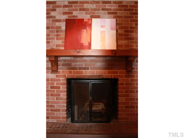 3519 Racine Street Durham, NC 27707 - Photo 10 of 24 Fabulous brick fireplace in the family room
