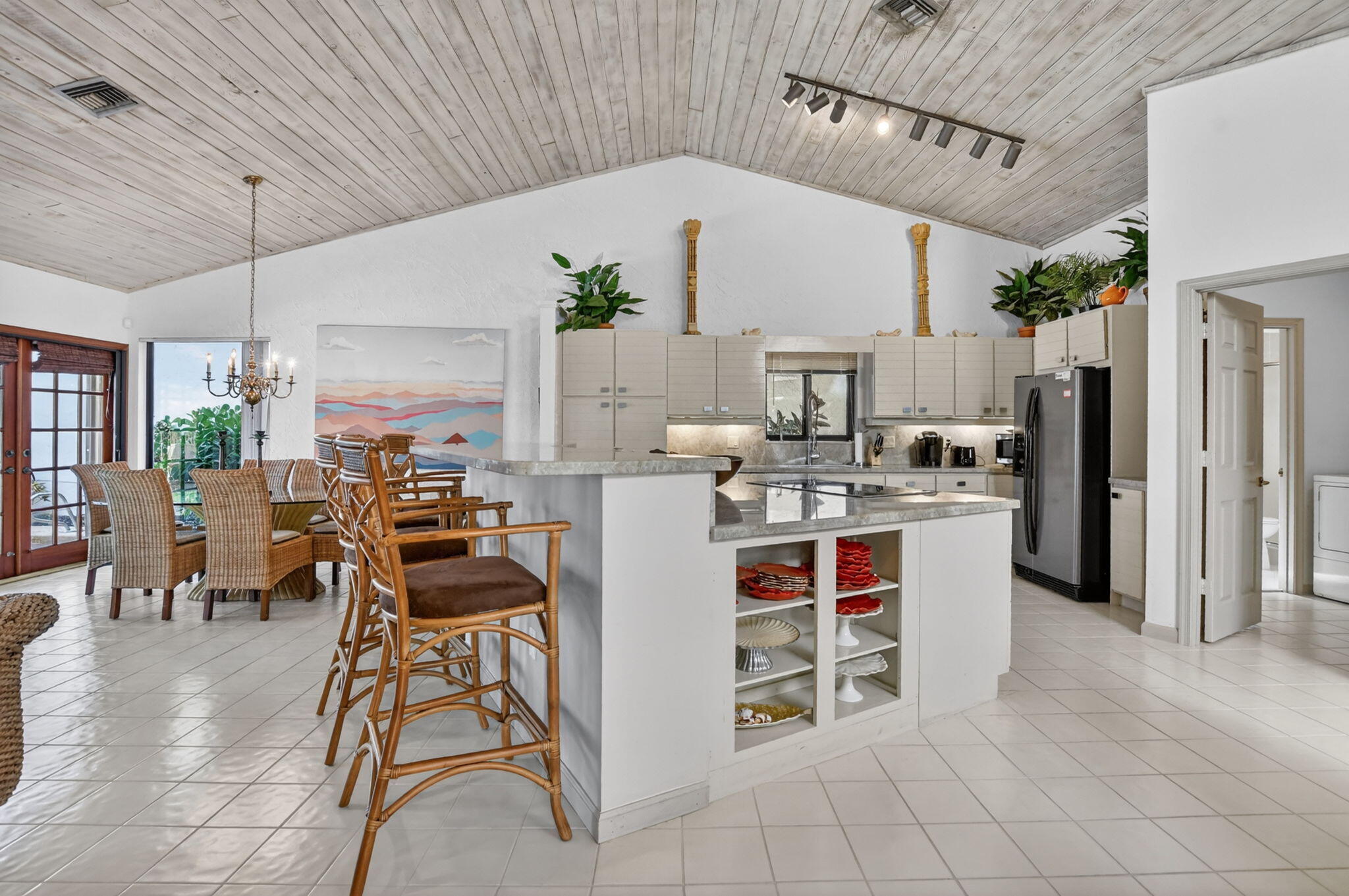 22519 Esplanada Circle, Unit W Boca Raton, FL 33433 - Photo 20 of 57 a kitchen with stainless steel appliances kitchen island granite countertop a refrigerator and cabinets