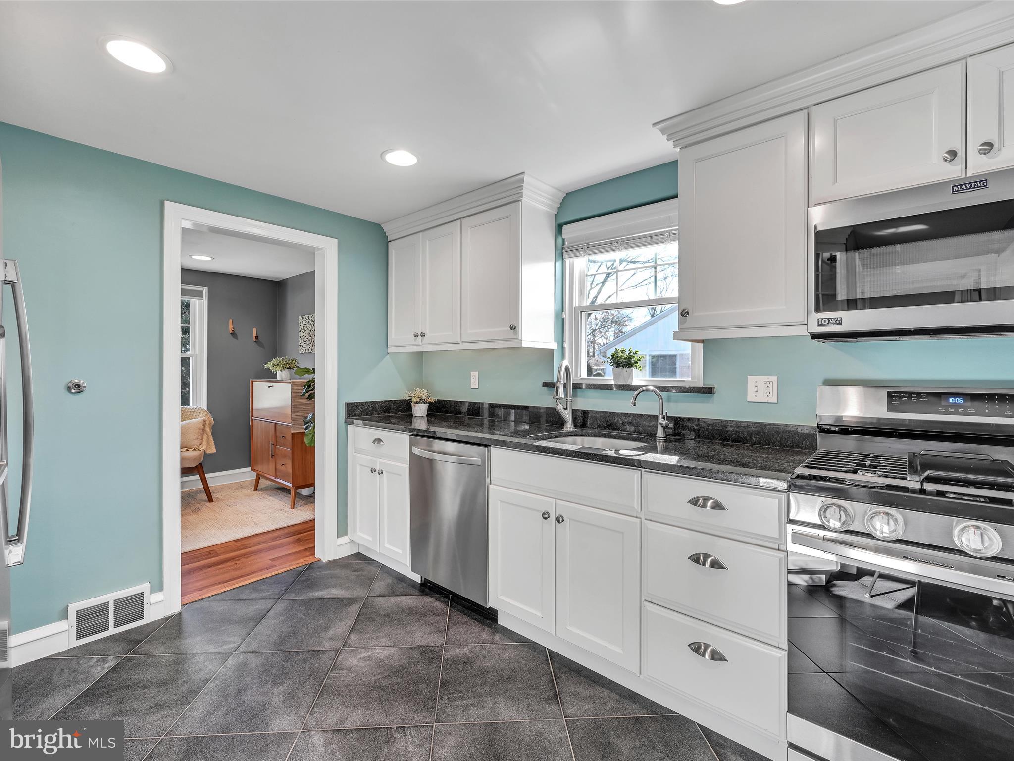 1027 Cardinal Road Audubon, PA 19403 - Photo 7 of 29 Bright Cheerful Kitchen with Stainless Appliances
