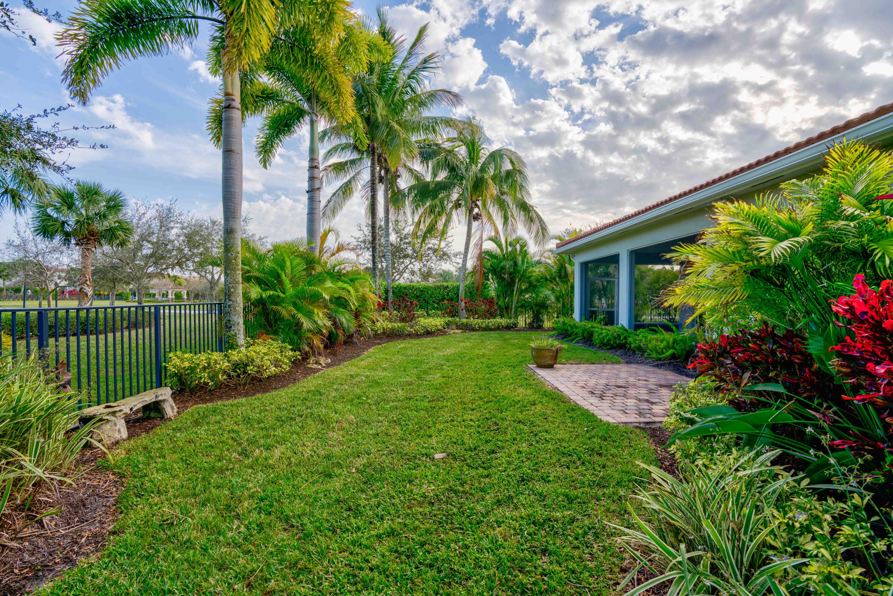 168 Umbrella Place Jupiter, FL 33458 - Photo 6 of 23 a view of a chair and table in the garden