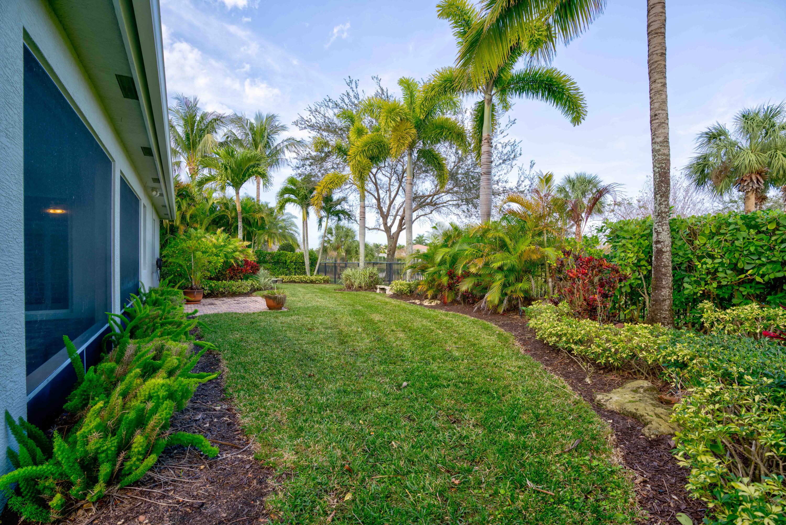 168 Umbrella Place Jupiter, FL 33458 - Photo 9 of 23 a view of a yard with plants