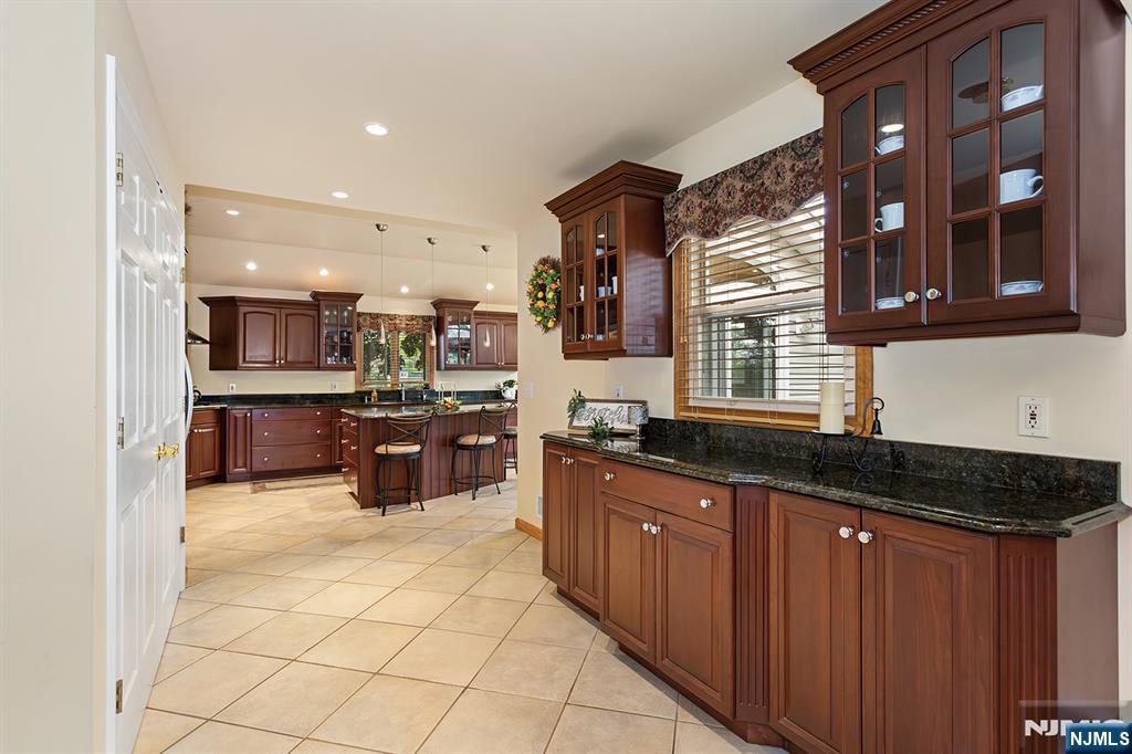 16 Barbara Way Wayne, NJ 07470 - Photo 12 of 35 a kitchen with stainless steel appliances a sink and a microwave