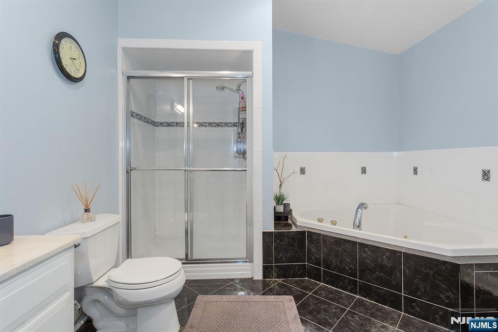 16 Barbara Way Wayne, NJ 07470 - Photo 19 of 35 a bathroom with a toilet and a shower
