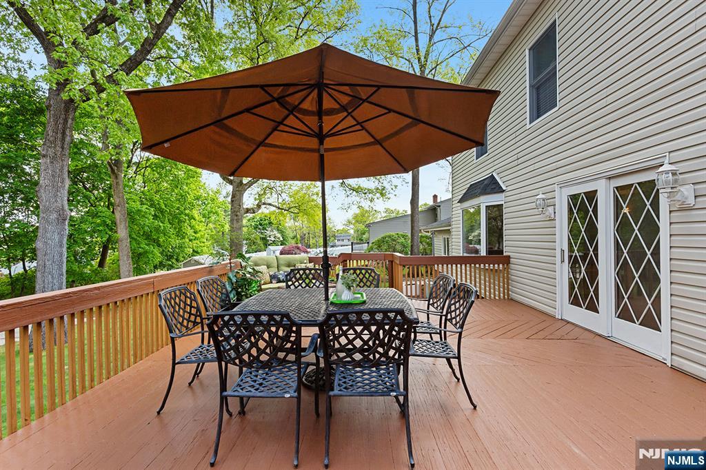 16 Barbara Way Wayne, NJ 07470 - Photo 31 of 35 a view of an outdoor sitting area with furniture and umbrella