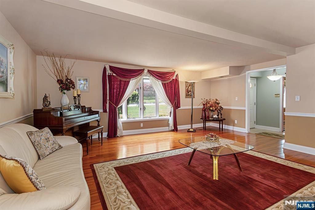16 Barbara Way Wayne, NJ 07470 - Photo 4 of 35 a living room with furniture and a wooden floor