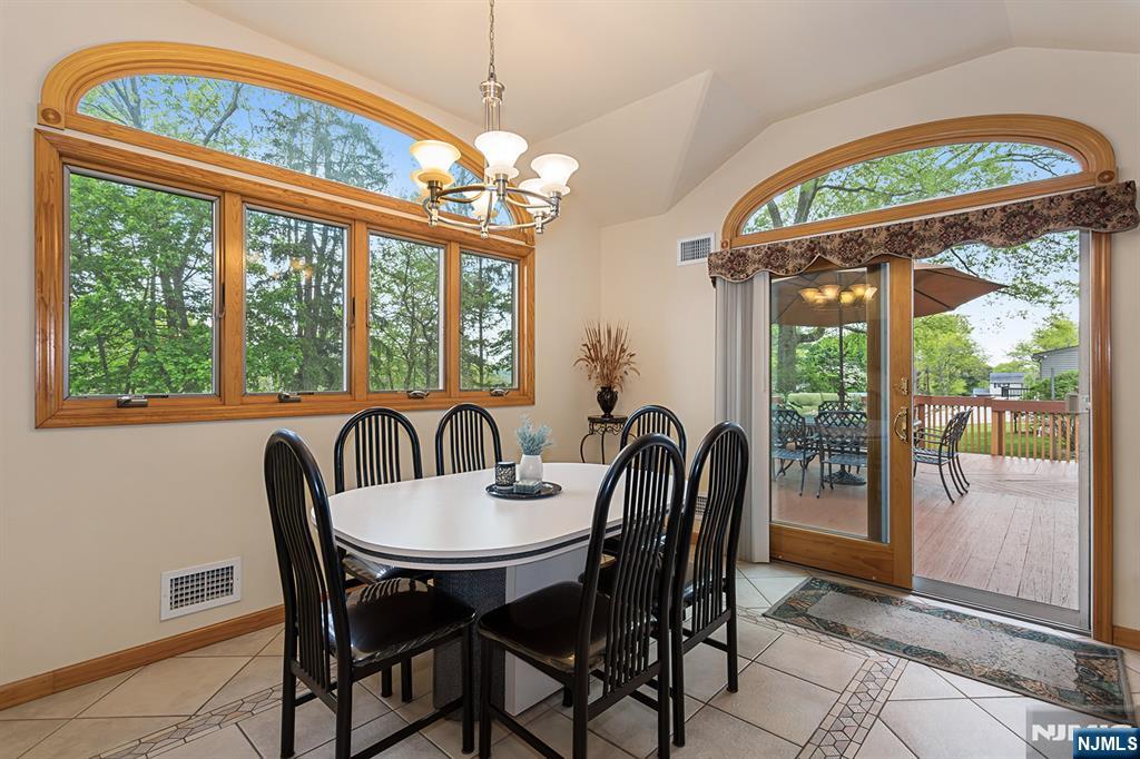 16 Barbara Way Wayne, NJ 07470 - Photo 9 of 35 a dining room with furniture a chandelier and a rug