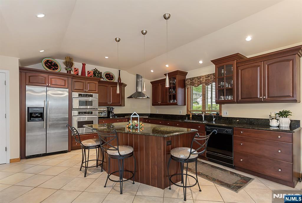 16 Barbara Way Wayne, NJ 07470 - Photo 10 of 35 a kitchen with granite countertop a sink cabinets and stainless steel appliances