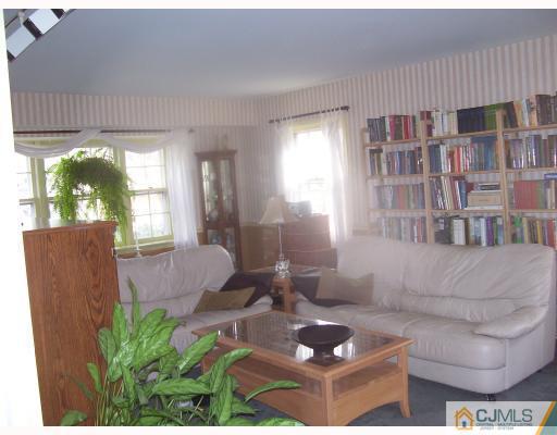 26 Johnson Road Somerset, NJ 08873 - Photo 2 of 9 a living room with furniture and a large window