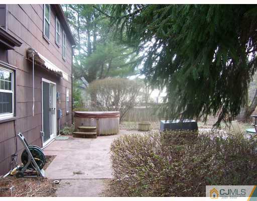 26 Johnson Road Somerset, NJ 08873 - Photo 7 of 9 a backyard of a house with yard and outdoor seating
